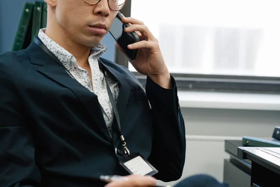 A professional taking a client call in the office