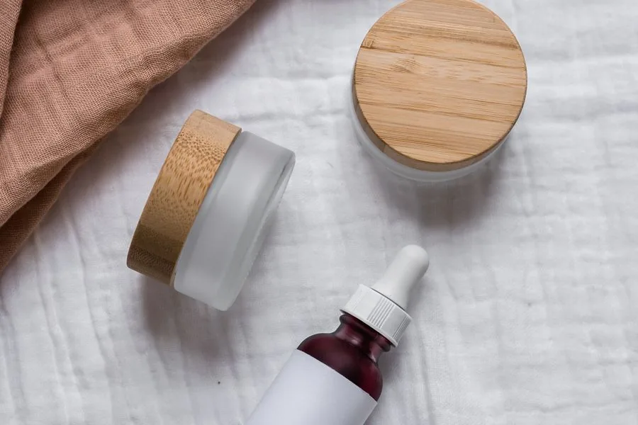 Unbranded skincare bottles and jars laid out for product photography