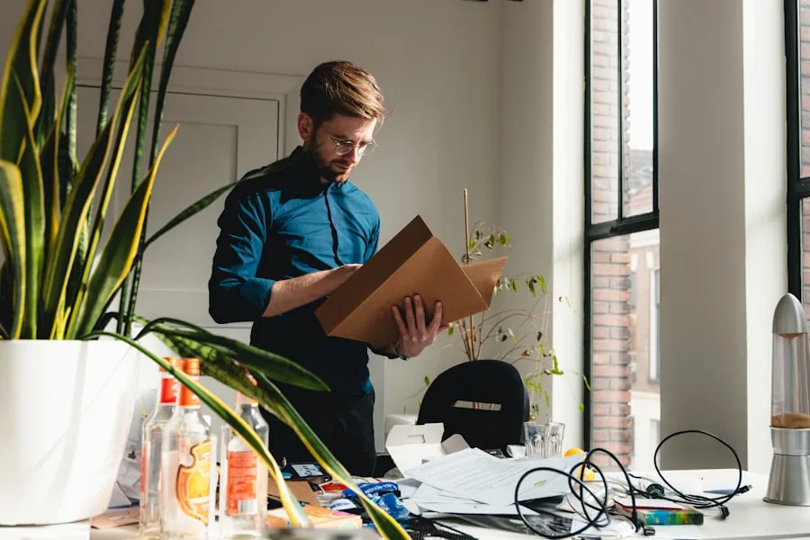 An online store owner reviewing a product package in a bright home office