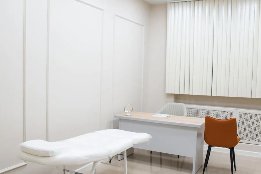 A clean, unbranded aesthetics clinic consultation room