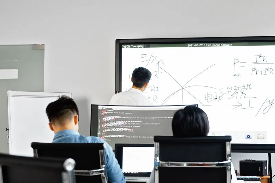 A SaaS team reviewing a product demo on screen together