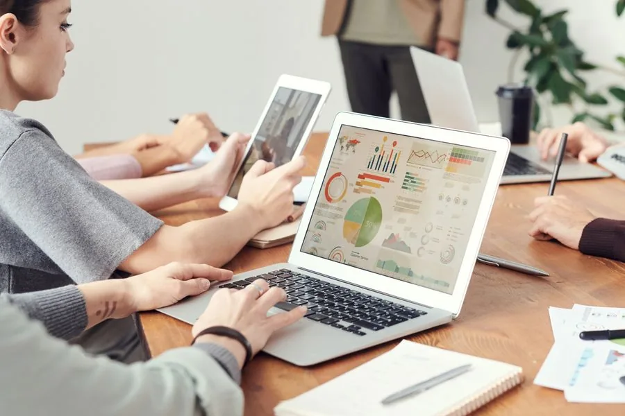 A B2B SaaS team reviewing comparison page analytics on a laptop